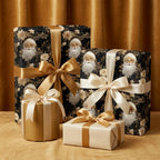 Luxury black and gold Christmas wrapping paper with vintage Santa pattern and satin bows by Wrapped Studios.