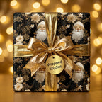 Black and gold vintage Santa Christmas wrapping paper with a metallic gold bow, by Wrapped Studios.