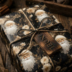 Elegant vintage Santa Claus Christmas wrapping paper on a gift with Noel tag, by Wrapped Studios.
