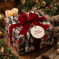Luxury dog Christmas wrapping paper with a red velvet bow and Merry Christmas tag by Wrapped Studios.