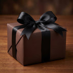 Elegant brown gift wrapping paper with a black satin ribbon bow for birthday or holiday presents.