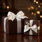 Elegant brown gift boxes wrapped with ivory satin ribbon and bows, perfect for Christmas or holiday gifts.