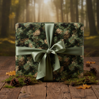 Christmas gift wrapped in forest green pine needle paper with olive satin ribbon on wood table.