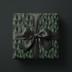 Dark pine forest Christmas gift wrap with luxury black satin bow by Wrapped Studios.
