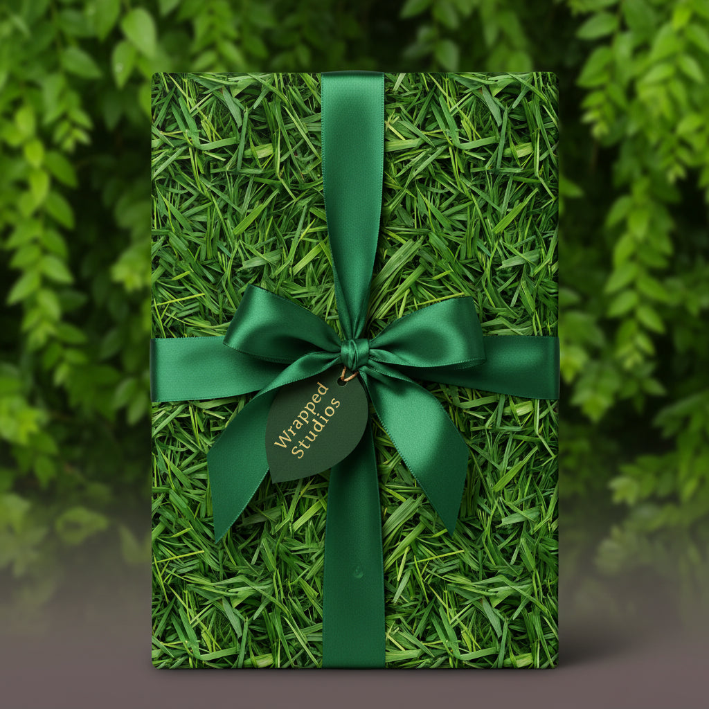 Gift wrapped in novelty grass-patterned wrapping paper with a green satin bow.