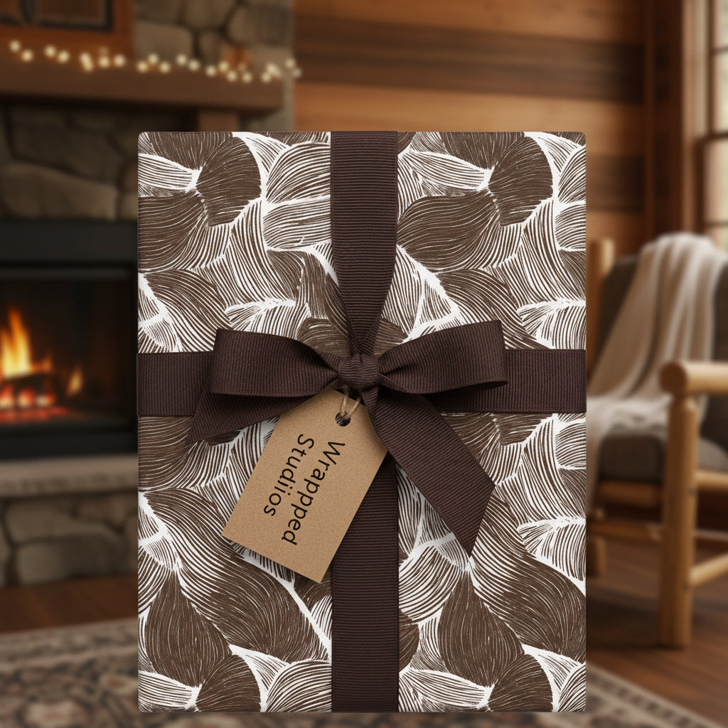 Elegant brown floral wrapping paper with ribbon and tag, perfect for luxury gift wrap occasions.