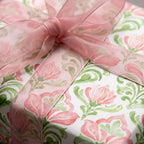 Pink floral wrapping paper with watercolor damask pattern and sheer pink bow by Wrapped Studios.