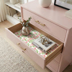 Pink floral wrapping paper used as an elegant drawer liner inside a dresser by Wrapped Studios.