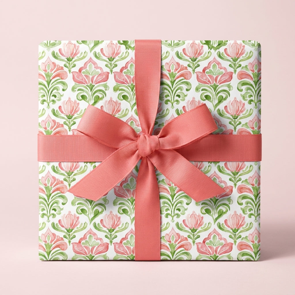 Elegant floral wrapping paper in pink and green with a coral ribbon, by Wrapped Studios.