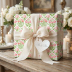 Elegant pink floral wedding gift wrap with a cream bow and Mr. & Mrs. tag by Wrapped Studios.