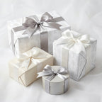 Elegant First Communion wrapping paper with silver chalice patterns and satin bows by Wrapped Studios.