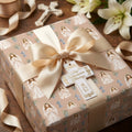 First Communion wrapping paper for girls with elegant satin bow and cross gift tag by Wrapped Studios.