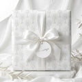 First Communion wrapping paper with a white chalice pattern and satin bow by Wrapped Studios.