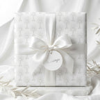 First Communion wrapping paper with a white chalice pattern and satin bow by Wrapped Studios.
