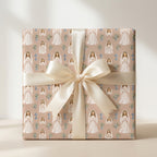 First Holy Communion gift wrap with praying girl illustration and cream bow by Wrapped Studios.