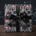 Luxury black floral wrapping paper with circuit board pattern and satin bow by Wrapped Studios.