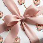 Acoustic guitar floral wrapping paper with a blush pink satin ribbon bow by Wrapped Studios.