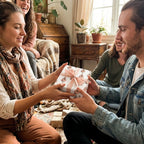 Friends exchanging a birthday gift in floral guitar wrapping paper with pink ribbon by Wrapped Studios.