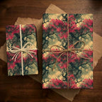 Two gifts wrapped in floral wrapping paper with pink blossoms and tied with twine.