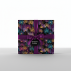 Elegant gift wrapped in floral wrapping paper with a purple ribbon and bow.