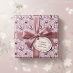 Elegant gift wrapped in pink floral wrapping paper with satin ribbon and "A special something just for you" tag.