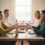 Family exchanging a gift wrapped in luxury floral wrapping paper with a lilac ribbon.