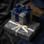Elegant navy and gold wrapping paper with ribbon bows.