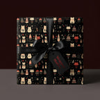 Cute cat Christmas wrapping paper in black with a satin bow, holiday gift wrap by Wrapped Studios.