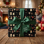 Cat Christmas wrapping paper by Wrapped Studios on a gift box with a green satin ribbon and From Santa tag.