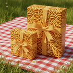Gifts wrapped in French fries pattern paper with mustard ribbon on a red and white gingham blanket.