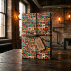Retro 50th birthday wrapping paper on a gift box with a Wrapped Studios tag on a wood table.