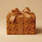 Square gift box wrapped in a unique brown bean-pattern wrapping paper and satin ribbon.