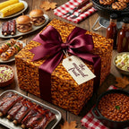 BBQ themed gift in novelty baked beans wrapping paper with a burgundy ribbon on a wooden table.
