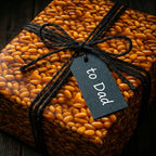 Unique "To Dad" birthday wrapping paper featuring a seed-like pattern and rustic twine bow.