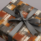 Modern gift wrap featuring an abstract pattern in brown, gray, and white, finished with a gray satin ribbon.