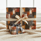 Modern geometric wrapping paper in brown, orange, and gray, tied with ribbon on gifts.