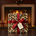 Geometric Christmas gift wrap with a red satin bow and "special something" tag sits before a cozy fireplace.