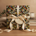 Modern gift wrapped in geometric square wrapping paper with cream ribbon and "Warmest Wishes" tag.