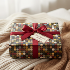 Gift wrapped in modern geometric wrapping paper with burgundy ribbon and tag.