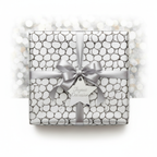 Modern luxury gift wrap with silver bubble pattern, satin ribbon, and "Joyous Occasion" tag against a bokeh background.