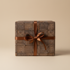 Elegant brown gift box wrapped in geometric patterned paper with a satin ribbon bow.