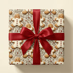 Gingerbread Christmas wrapping paper with a red satin bow on a gift box by Wrapped Studios.