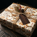 Gingerbread holiday wrapping paper on a Christmas gift with rustic twine by Wrapped Studios.