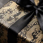 Black and gold circuit board tech wrapping paper with a luxury satin bow by Wrapped Studios.