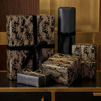 Luxury black and gold circuit board wrapping paper with velvet ribbons by Wrapped Studios.