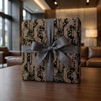 Tech circuit board wrapping paper in black and gold with a grey ribbon by Wrapped Studios.