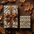 Luxury ginkgo leaf autumn wrapping paper on gifts with brown ribbons and fall leaves by Wrapped Studios.
