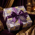 Wrapped Studios luxury gift wrap with marble swirl pattern and purple ribbon.