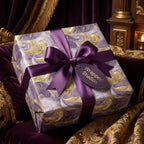 Wrapped Studios luxury gift wrap with marble swirl pattern and purple ribbon.