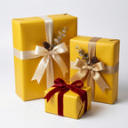 Three yellow gift boxes wrapped with cream, gold, and red velvet ribbon for birthdays or holiday presents.